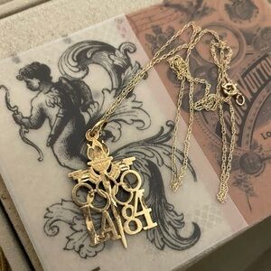 14kt solid gold LA 1984 Olympics pendant with 10kt twisted rope chain necklace